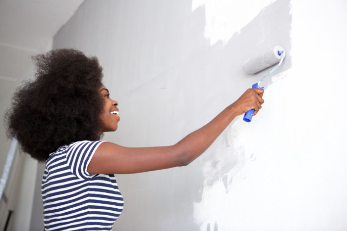 Painting a room with a paint roller